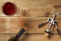 Glass of red wine, cork and a bottle on a wooden table Royalty Free Stock Photo