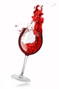 Glass with red wine and splashes of fluid isolated on white background. Royalty Free Stock Photo