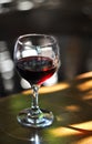 Glass of red wine on the table in restaurant interior