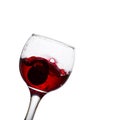 Glass of red wine tilted on a white background Royalty Free Stock Photo