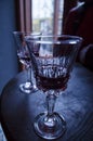 A glass of red wine on vintage wine table, cherry Royalty Free Stock Photo