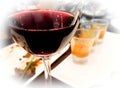 Glass of red wine after wine testing party. Royalty Free Stock Photo