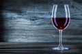 Glass with red wine on wintage wood close up view Royalty Free Stock Photo