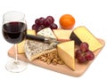 A glass of red wine and a wooden board with cheese, nuts, grapes Royalty Free Stock Photo