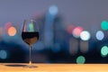 A glass of red wine on wooden table. Royalty Free Stock Photo