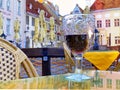 Glass of red wine on wooden table top in  summer terrace restaurant lounge in medieval Tallinn old town city lifestyle holiday tra Royalty Free Stock Photo