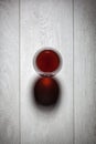 Glass of red wine on wooden table. Royalty Free Stock Photo