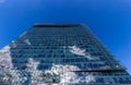 Glass reflective office buildings against blue sky with clouds and sun light Royalty Free Stock Photo