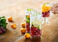 Glass refreshing drink of mix fruits on wooden background