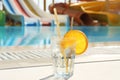 Glass of drink near swimming pool Royalty Free Stock Photo