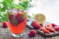 Glass of refreshing iced tea with strawberries and mint, horizon Royalty Free Stock Photo