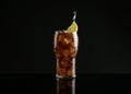 Glass of refreshing soda water with ice cubes and lemon slice on black background Royalty Free Stock Photo