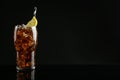 Glass of refreshing soda water with ice cubes and lemon slice on black background, space for text Royalty Free Stock Photo