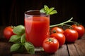 Glass of refreshing tomato juice and ripe tomatoes on a wooden table. Royalty Free Stock Photo