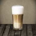 Glass of rich foamy Italian Macchiato coffee