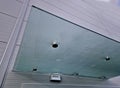 Glass roof above entrance industrial building with metal cladding