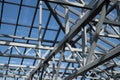Glass roof against the blue sky. Modern architectura with glass roof, details. Royalty Free Stock Photo