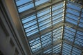 Glass roof in shopping mall. Details of interior in building. Light through glass. Dome in building Royalty Free Stock Photo