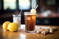 glass of root beer with a bendy straw and lemon slice Royalty Free Stock Photo