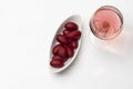 Glass of rose wine and olives in a white plate Royalty Free Stock Photo