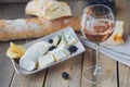 A glass of rose wine served with cheese plate, blackberries and Royalty Free Stock Photo