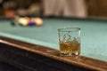 glass of Rum on a billiard table