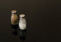 Glass salt and pepper shakers on black background Royalty Free Stock Photo