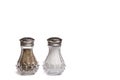 Glass Salt and Pepper Shakers with Silver Metal Lids on White Background with Copy Space Royalty Free Stock Photo