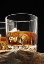 Glass of scottish whiskey with ice cubes