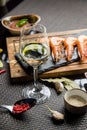 glass of semi-dry white wine an aperitif. Wine with grilled meat and vegetables. Close-up. Concept - table setting in a