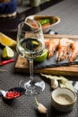 glass of semi-dry white wine an aperitif. Wine with grilled meat and vegetables. Close-up. Concept - table setting in a