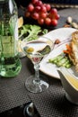 glass of semi-dry white wine an aperitif. Wine with grilled meat and vegetables. Close-up. Concept - table setting in a