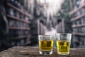 Glass shots with yellow liqour resembling whiskey