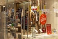 Glass showcase of a clothing store with mannequins in a shopping mall. Moscow, Russia, 01/10/2020