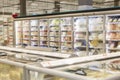 Glass showcases with frozen foods in a supermarket. Blurred