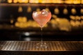 Glass of a Sicilian Tonic cocktail decorated with orange slice