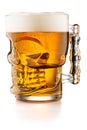 Glass skull shaped mug with beer isolated on white background Royalty Free Stock Photo