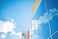 glass skyscraper facade reflecting blue sky Royalty Free Stock Photo