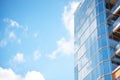 glass skyscraper facade reflecting blue sky Royalty Free Stock Photo