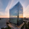 Glass Skyscraper Reflecting Cityscape at Sunset Royalty Free Stock Photo