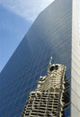 Glass skyscraper tall modern building, reflection, blue sky, copy space, front view Royalty Free Stock Photo