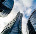 Glass skyscrapers of irregular shape. Bottom view. Abstract architectural detail of corporate building suitable as Royalty Free Stock Photo