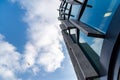 Glass skyscrapers of irregular shape. Bottom view. Abstract architectural detail of corporate building suitable as background. Royalty Free Stock Photo