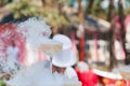 Glass is smoking in the head of pyramid of champagne close up. Beginning of wedding ceremony,