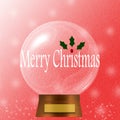 Merry Christmas snow globe decorated with red berrie and hollies Royalty Free Stock Photo