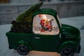Glass snowball in the form of a car with Santa Claus.