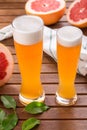 Glass of sour Grapefruit Craft Beer on wooden table