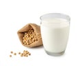 Glass of Soy milk with soybeans in bag isolated on white background Royalty Free Stock Photo