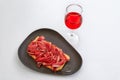 Spanish rose wine and Jamon Iberico ham sandwich at a restaurant, Pamplona Spain Royalty Free Stock Photo