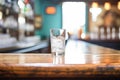 glass of sparkling water on a bar with ambient lighting